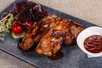 Grilled pork ribs with celery and carrot