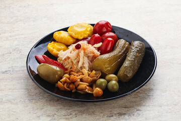 Plate with pickled vegetables and mushrooms