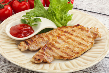 Grilled pork steak with ketchup