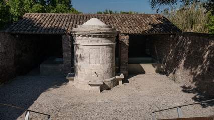 ancient marble wash-house. typical of Sardinian custom. completely refurbished with the fountain and the tap running.