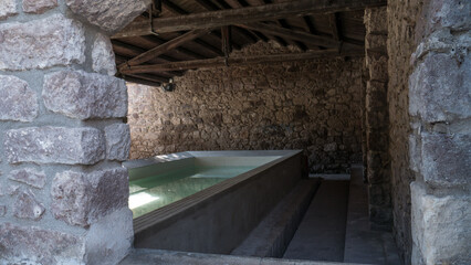 ancient marble wash-house. typical of Sardinian custom. completely refurbished with the fountain and the tap running.
