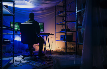 Rear view of American hacker in military unifrorm on dark web, cyberwar concept.