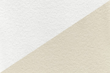 Texture of craft white and beige paper background, half two colors, macro. Structure of vintage...
