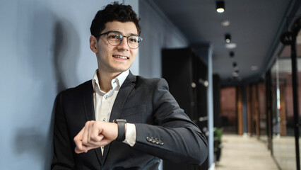 Career manager with glasses work office in a dark business suit