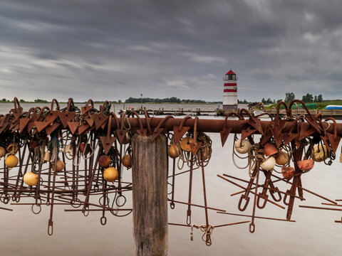 The island of Ummanz at the Ostsee area with traditional lighthouse and a collection anchors