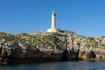Mouro island lighthouse with blue sky in the background, North of Spain.