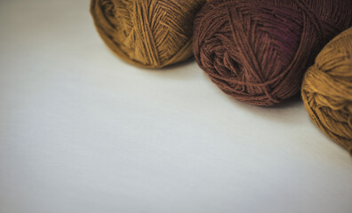 Close Up of yarn balls. Rainbow colors. Yarn for knitting. Skeins of yarn. Knitting needles,...