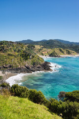 Landscape view on the Bay Of Islands, Northland, New Zealand on a sunny day with pure blue sky above the turquoise waters of the pacific ocean 