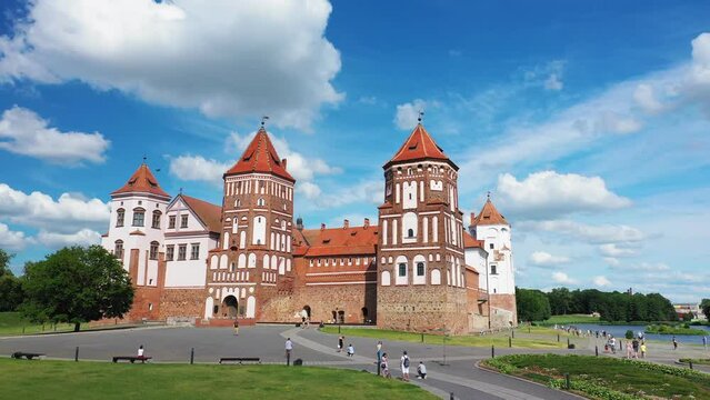 View of Mir castle, Belarus.Castle and park complex "Mir". View of the central part of the palace. Tourists take pictures and walk along the walls of the Mir Castle.