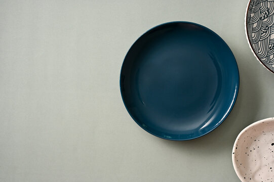 Minimal stylish dining table setting with minimal dark blue plate