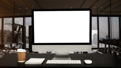 Computer Monitor, Keyboard, or White Screen Isolated is on the work table at the fitness gym .
