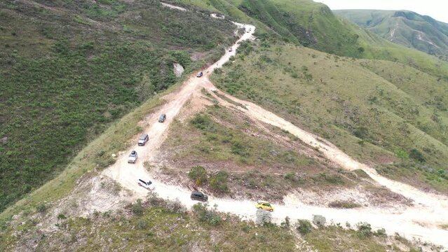 4x4 off road vehicles on rough terrain trail in Serra da Canastra National Park in overland event, Minas Gerais, Brazil
