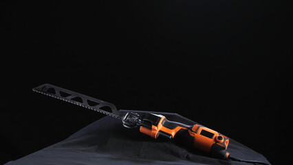 Close-up of professional automatic saw for the brick cutting on the black background. Stock...
