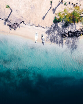 Top view of two yachts at the tropical island seabeach