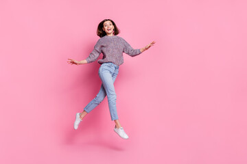 Fototapeta na wymiar Photo of sweet excited woman wear pullover walking running jumping empty space isolated pink color background