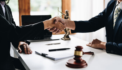 Businessman shaking hands to seal a deal Judges male lawyers Consultation legal services Consulting...