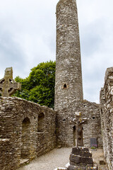 Fototapeta na wymiar Muiredach's Cross, Monasterboice Monastery in southern Ireland. Celtic High Cross in the historic ruins of Monasterboice, an early Christian settlement near Drogheda in County Louth, Ireland