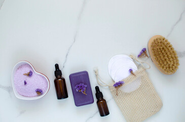 A set of eco-spa products and reusable bathroom tools on a marble background. The concept of zero waste is an image. He was lying flat. Copy space.