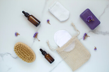 A set of eco-spa products and reusable bathroom tools on a marble background. The concept of zero waste is an image. He was lying flat. Copy space.