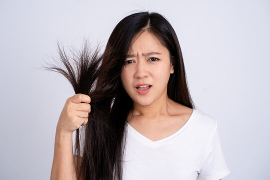 Woman with hair problems - brittle, damaged, dry, dirty and loss hair concept
