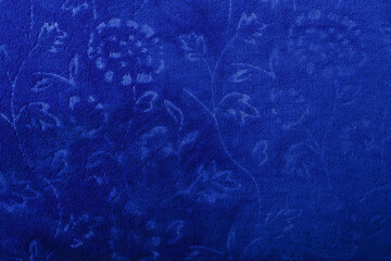 Microfibra dark blue towel fabric texture with floral pattern, background or backdrop
