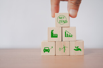 senior's hand holding net zero icon for health world ,CSR, eco green sustainable living, zero waste, plastic free, earth day, world environment day, responsible consumption Social responsibility