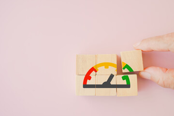 businessman hand complete level indicator rating print screen wooden cube block since low to high on pink background for Risk management and assessment concept