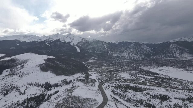 Aerial View of Keystone Ski Resort, Colorado USA on Winter Season, Clouds Above Hills and Village, Drone Shot