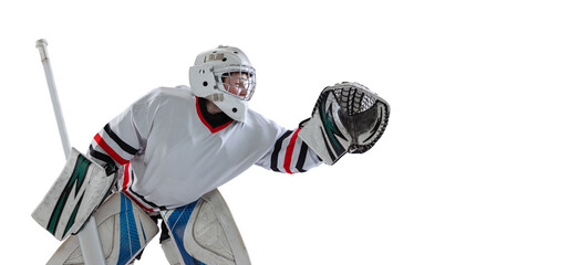 Portrait of young by, teen hockey player, goalkeepr training, catching puck isolated over white studio background. Flyer