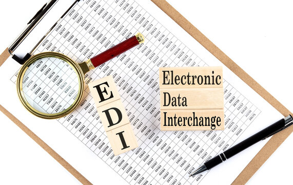 Paper with EDI -Electronic Data Interchange a table on a charts, business concept