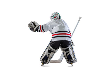 Back view portrait of young boy, child, hockey player training isolated over white studio background