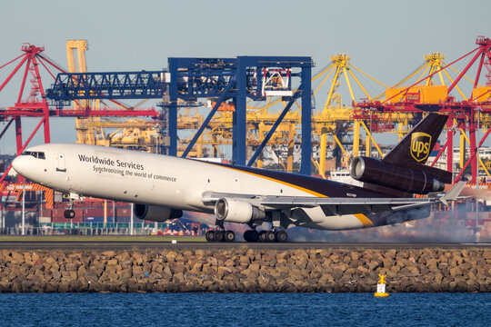 Sydney, Australia - May 5, 2014: United Parcel Service McDonnell Douglas MD-11 cargo aircraft landing at Sydney Airport.