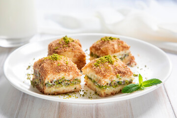 Traditional turkish new dessert cold milky baklava with pistachio (Turkish name; soguk baklava)