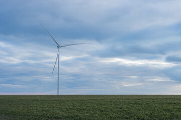 Fototapeta na wymiar a meadow with wind turbines that generate electricity