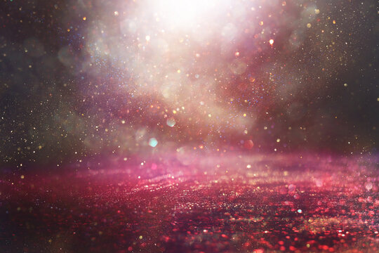 purple, gold and black glitter vintage lights background. defocused