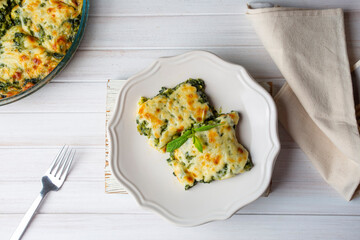 Baked Spinach with cheese delicious Italian food cuisine. Spinach gratin.