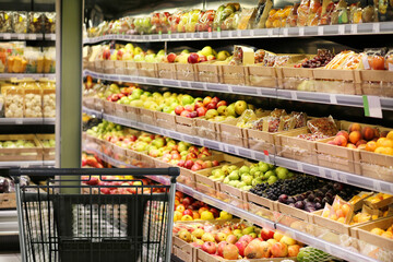 Choosing food from shelf in supermarket,vegetables in grocery section,Grocery stores