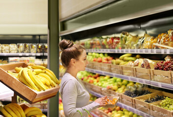 Woman buying fruits at the market