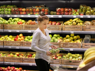 Woman buying fruits at the market