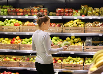 Woman buying fruits at the market