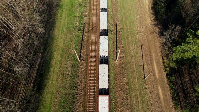 Freight Cars Deliver bulk Materials and gravel. Open Hoppers on railroad. Freight train with petroleum tank cars. Rail cars carry oil, crude and gas, ethanol. Railway logistics explosive cargo. 