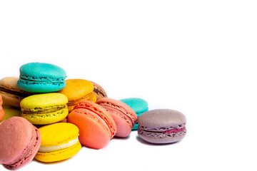 Colorful macaroon cakes. Small french muffins. Colorful macarons on a white background