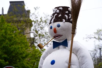 Fotobehang Children's parade of Spring Festival at City of Zürich with Snowman carrying broom, hat and smoking pipe. Photo taken April 24th, 2022, Zurich, Switzerland. © Michael Derrer Fuchs
