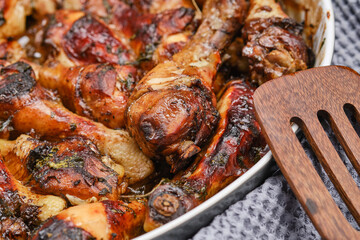 Hot homemade chicken with balsamic vinegar sauce in a baking dish. Shallow depth of field