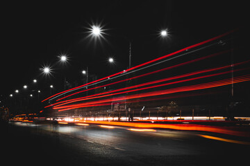 Fototapeta na wymiar Long exposure at night. City traffic light and street view. 