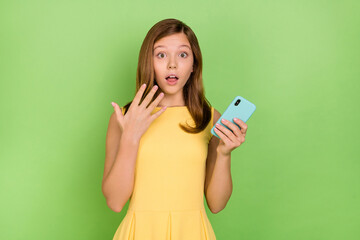 Photo of teenager kind sweet girl hear unexpected bad news see big sale bargain isolated on green...
