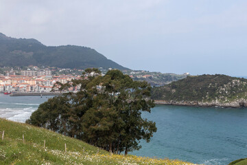 Fototapeta na wymiar panoramic view of lekeitio island a cloudy spring day