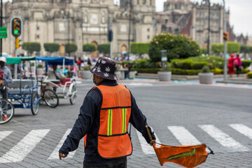 Obraz premium Mexico City, CDMX, Mexico, OCT, 24 2021, Traffic inspector controlling vehicles near the Zócalo