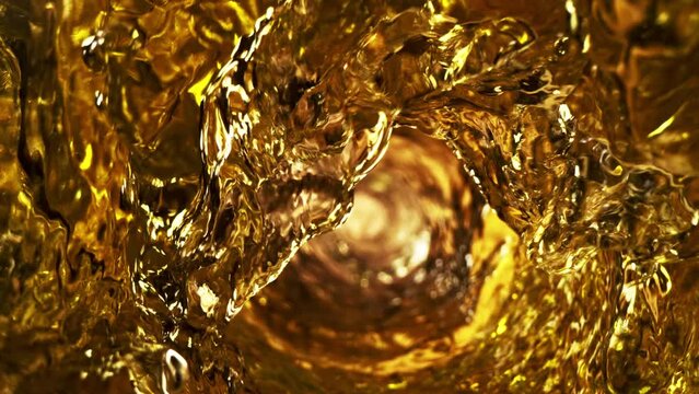 Super slow motion of pouring whiskey or ice tea drink in twister shape. Filmed on high speed cinema camera, 1000 fps.