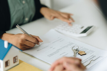 Close up Business woman or Real Estate agent explain signing agreement for buying house. Bank manager and real estate concept.